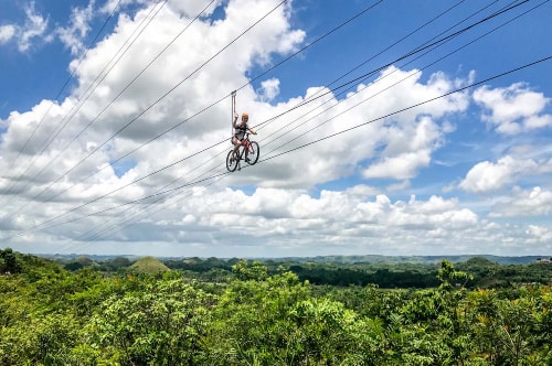 Philippines-Bohol-Island-Chocolate-Hills-Adventure-Park-Zip-Lining-on-a-bike-17708 COVER