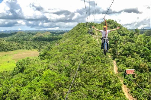 Philippines-Bohol-Island-Chocolate-Hills-Adventure-Park-Zip-Lining-on-a-bike-17744 COVER